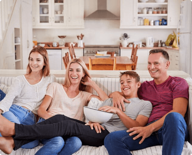 Family sitting together on a couch
